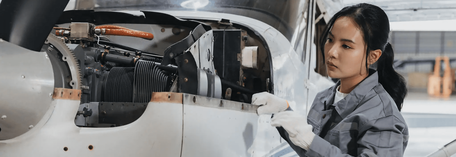 Mechanic inspecting aircraft engine